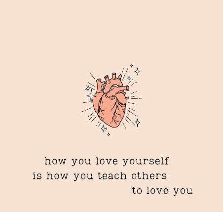 Woman writing self love poetry in her journal with morning light