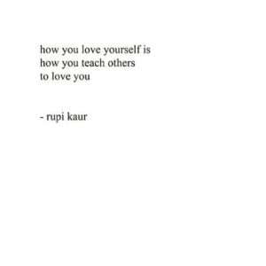 Poetry lines about self-love and empowerment on an open page